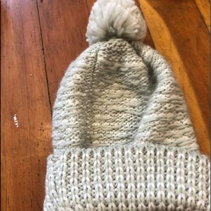 Gray hat with a Pom Pom